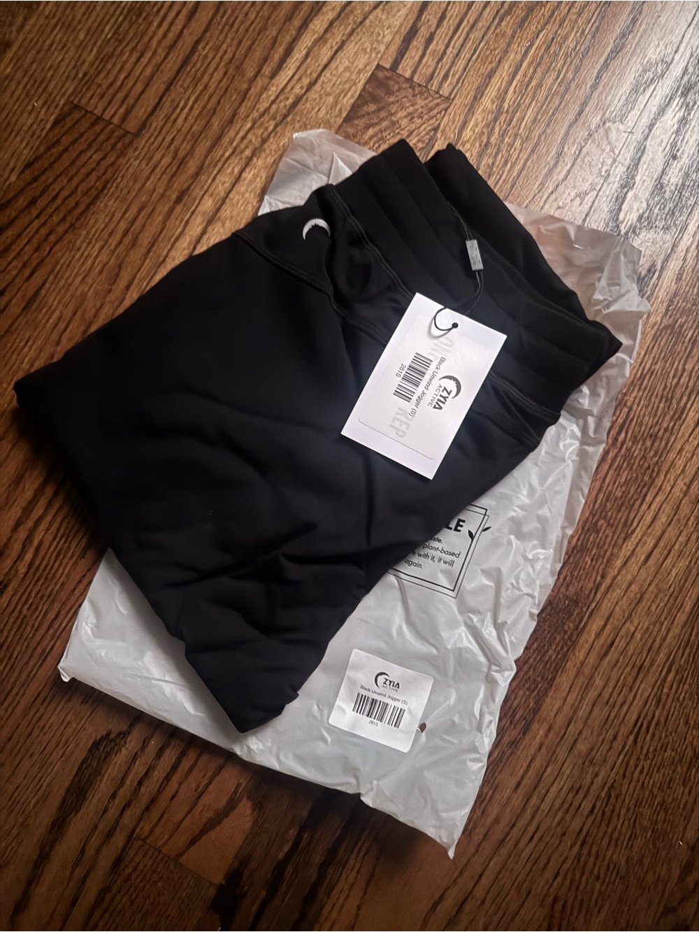 NWT and bag ZYIA Black Unwind joggers, size small